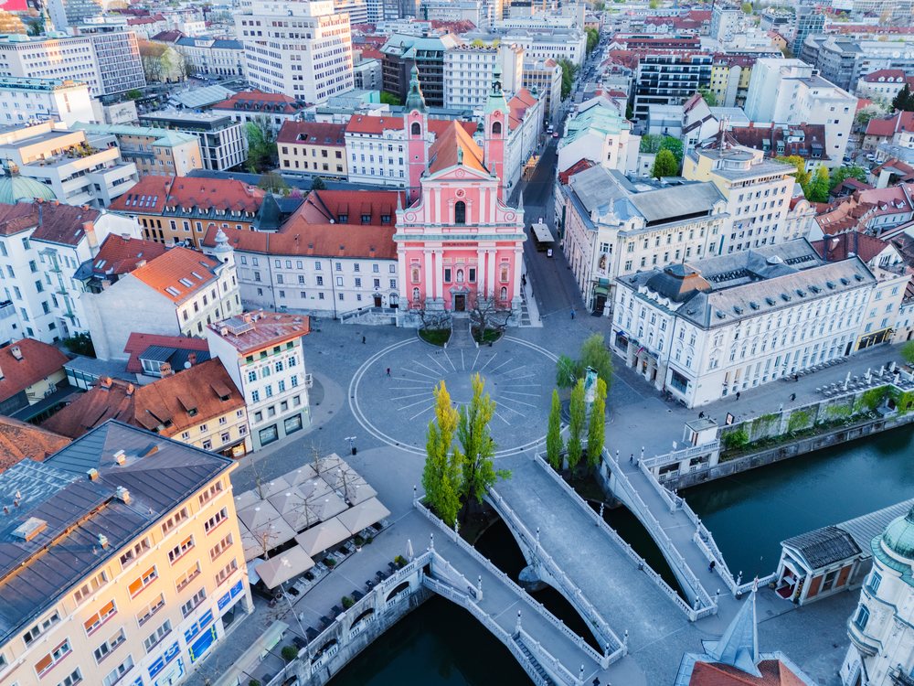Prešernov Square and Triple Bridge, at Sunrise showing historic buildings and urban cityscape, LjubLjana, Slovenia.