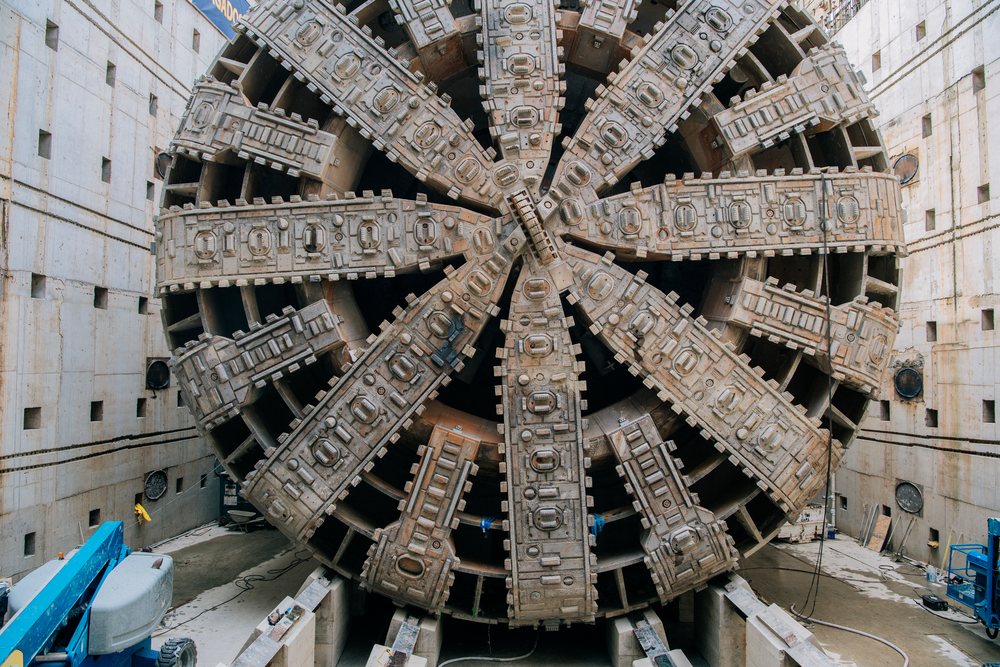 Tunnel boring machine head at a construction site drilling underground infrastructure, USA.