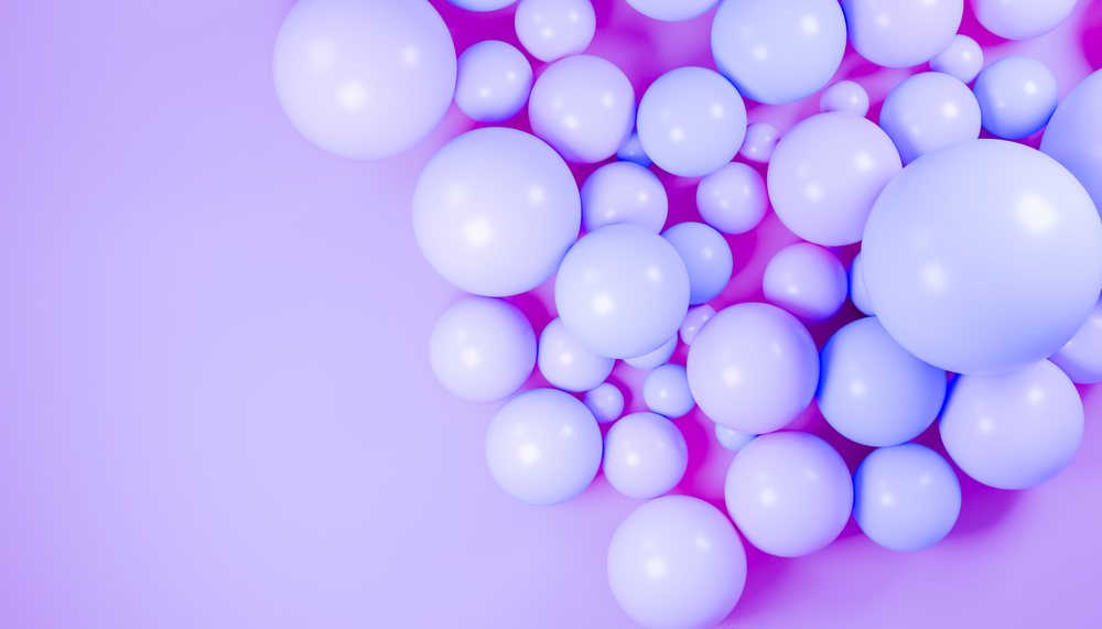 Abstract 3D rendering of a cluster of glossy blue spheres on a smooth purple background.