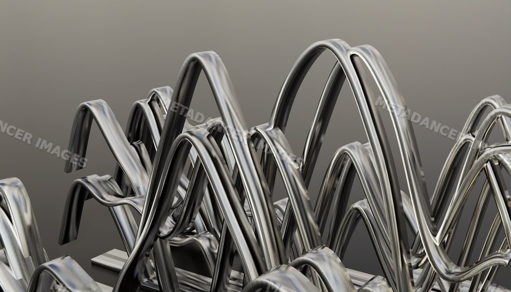 Close-up view of abstract curved metal sculpture with intertwined