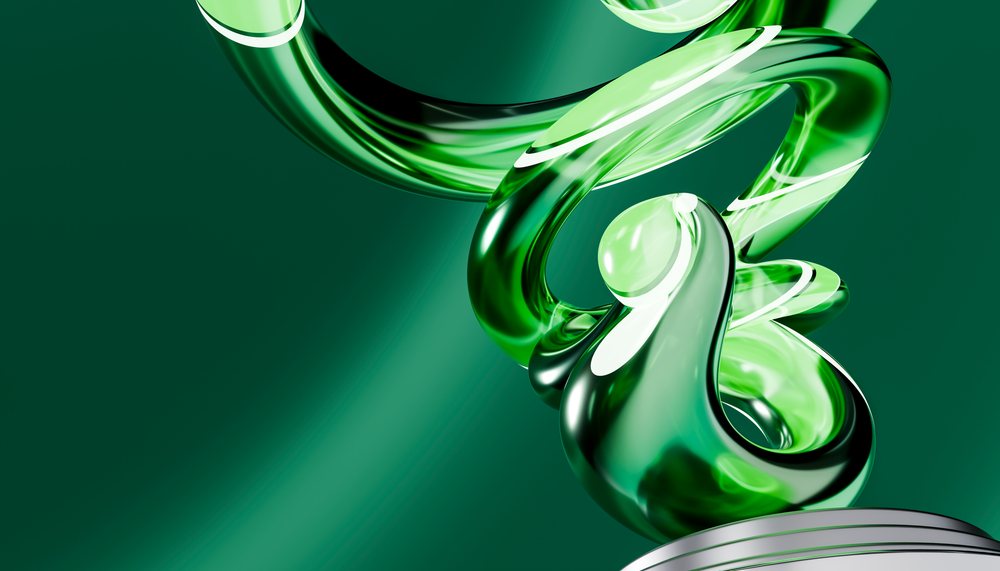 Green abstract glass sculpture with twisted and curved shapes displayed against a green background.