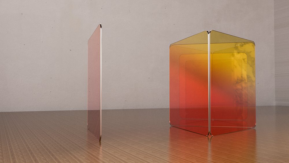 Translucent colored glass panels arranged on a wooden surface in a minimalist room corner.