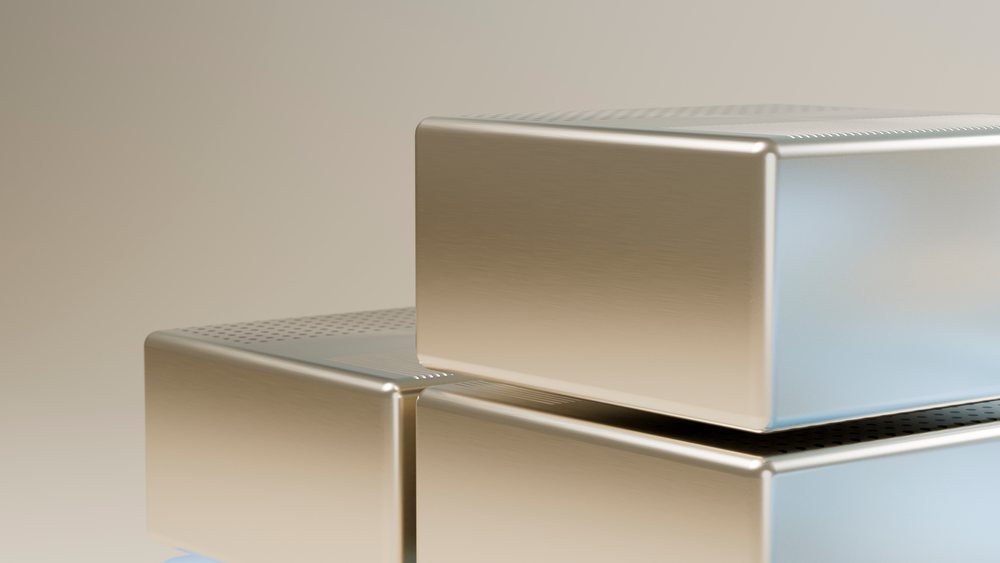 Stacked rectangular silver metal boxes with perforated lids feature a modern, clean, and brushed metal design.