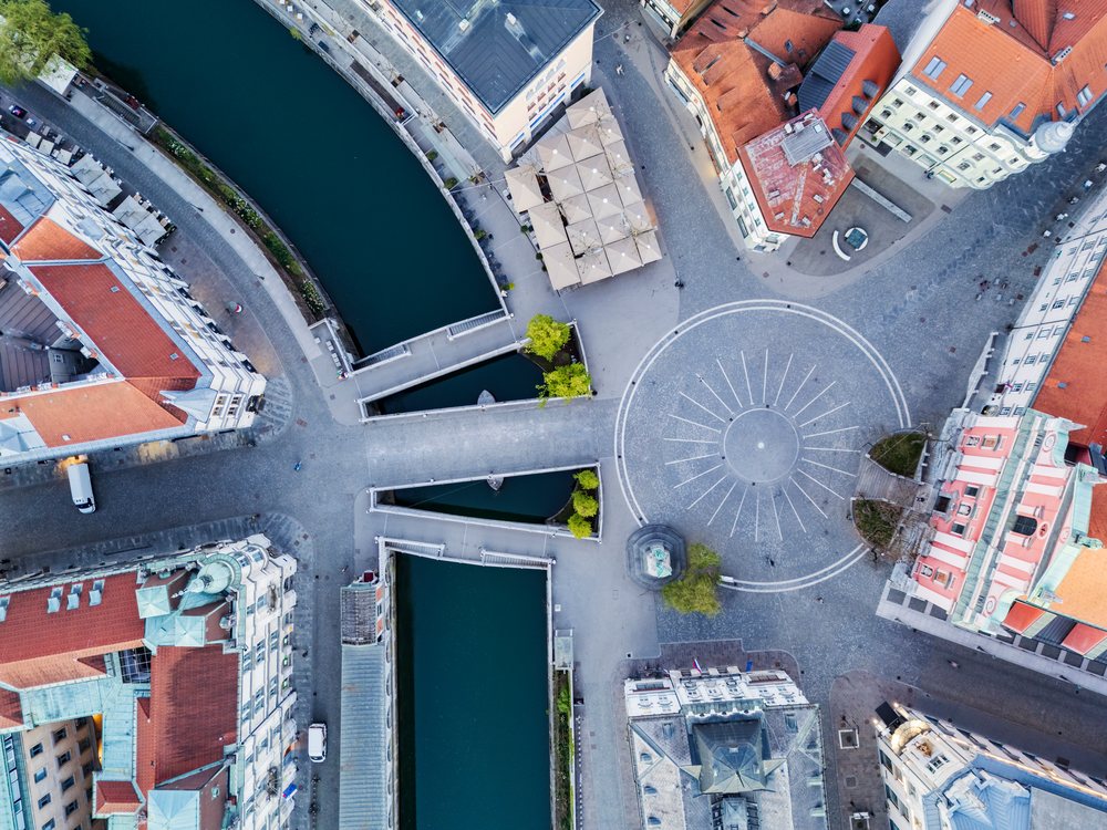 Sunrise aerial view of Prešernov Square and the Triple Bridge over the river, landscape, cityscape, LjubLjana, Slovenia.