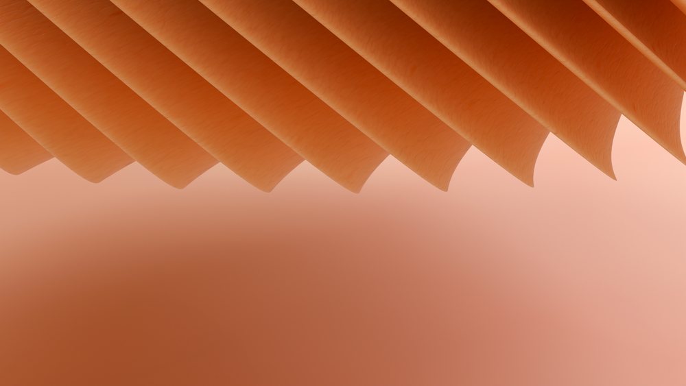 Close-up of orange acoustic guitar strings stretched across the instrument's neck showing string texture and tension.