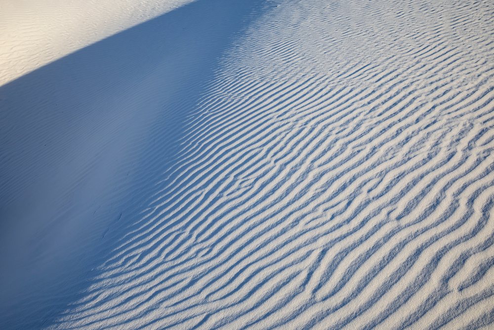Wind-formed ripples and shadows on white sand dunes at white Sands National Park, landscape, wildlife, Alamogordo, New Mexico, USA.
