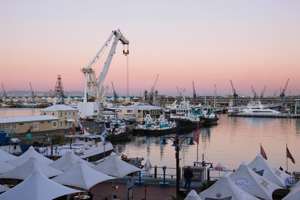 Victoria & alfred waterfront harbor with boats and cranes at dawn, Cape Town, Western Cape, South Africa.