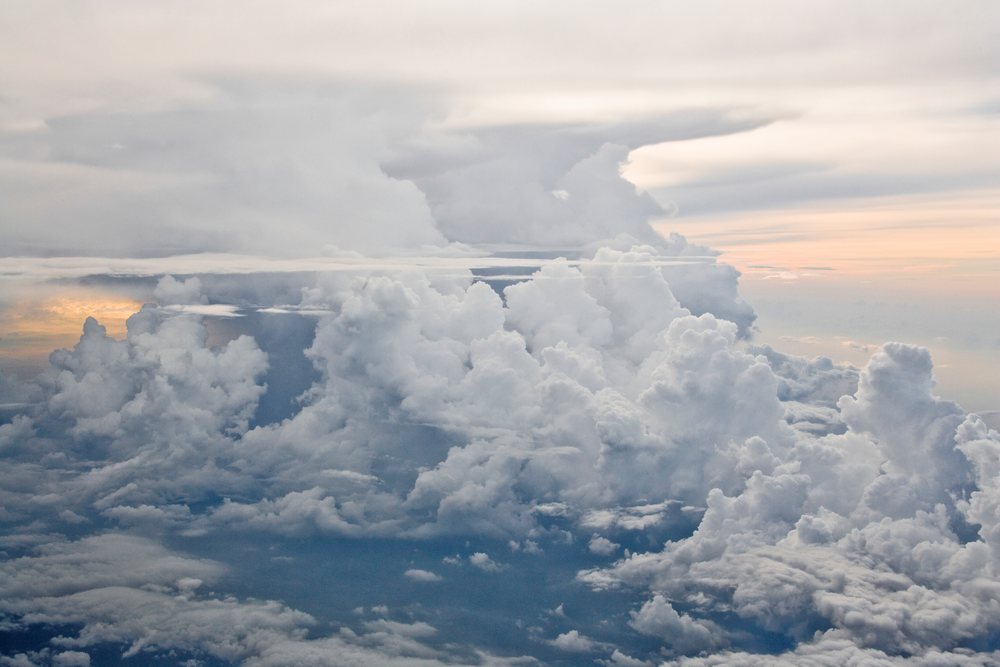 Cumulus clouds with puffy shapes fill the sky.