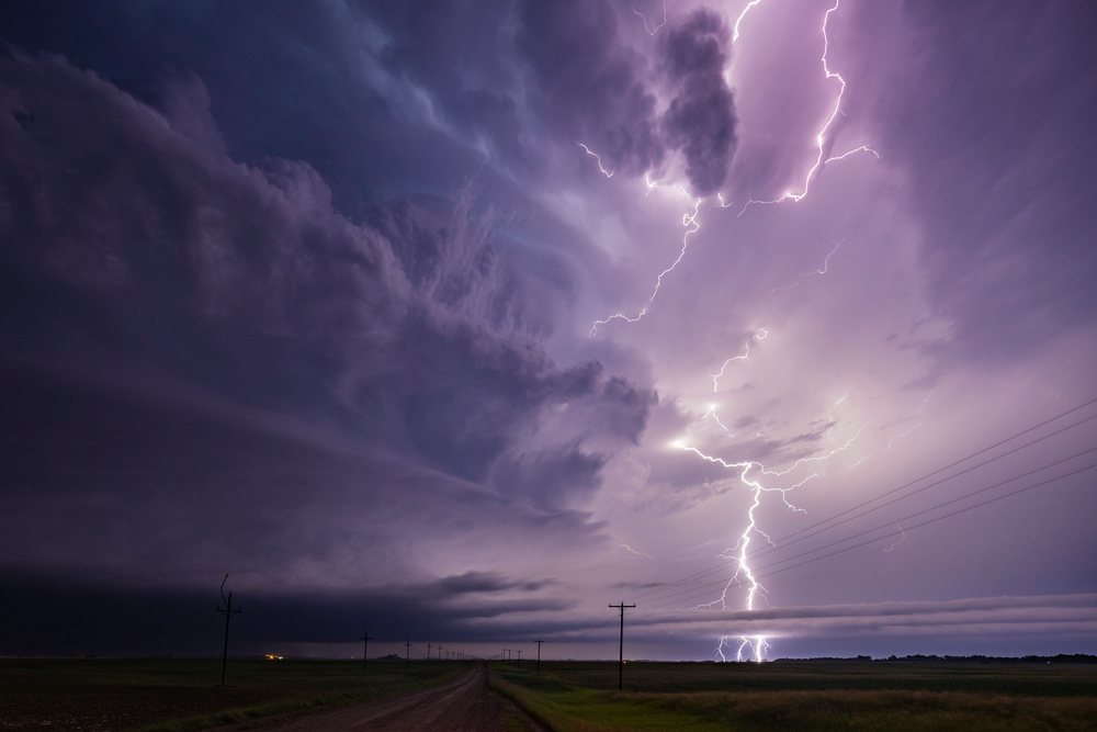 Lightning strikes from a Tornado-Producing Supercell storm over a rural landscape, Lisbon, North Dakota, USA.