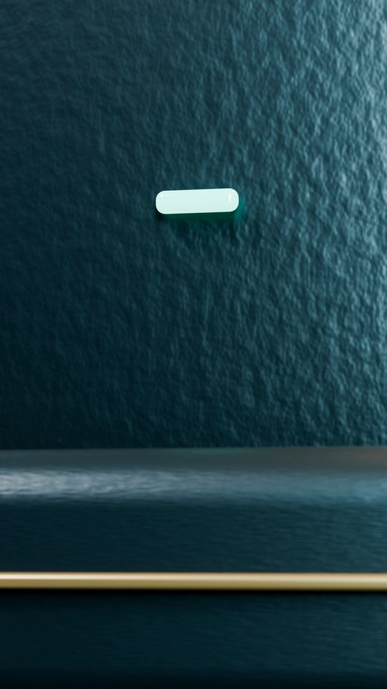 Single white capsule pill floats against a blue textured surface in a minimalist setting.