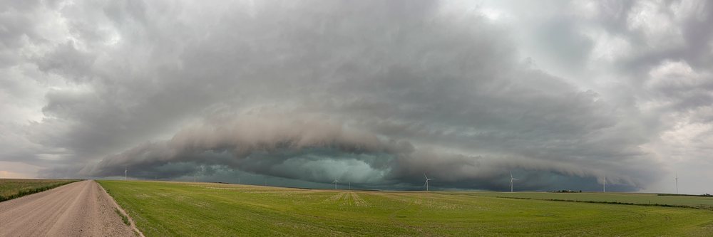 Storm with a Mesocyclone creates a Rotating Updraft over wind turbines and farmland in Tornado Alley, Fleming, Colorado, USA.