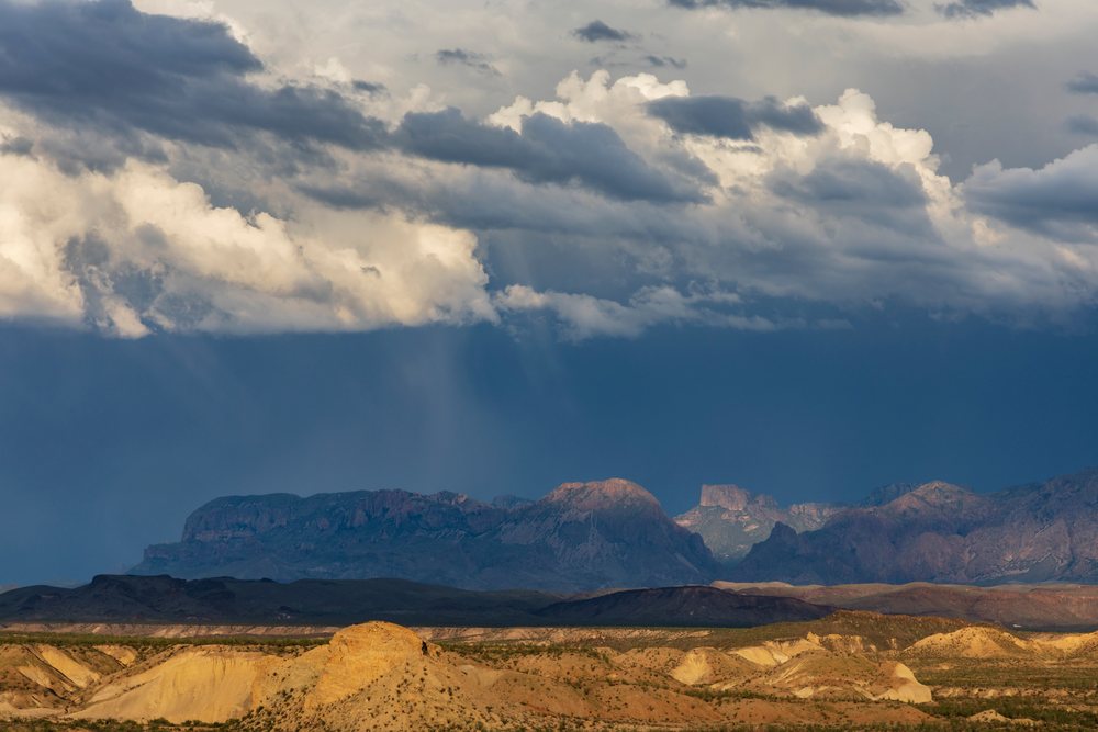 Chisos Mountains at Sunset with dramatic clouds over desert terrain, Landscape, Wildlife, Study Butte, Texas, USA.