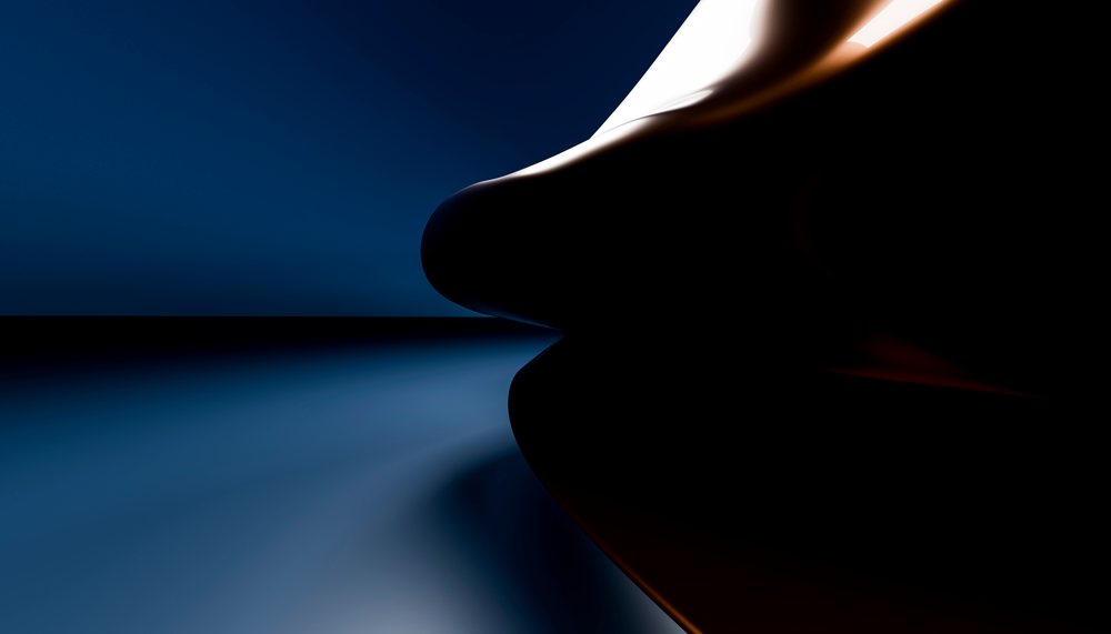 Silhouette of face profile with dramatic lighting against dark background.