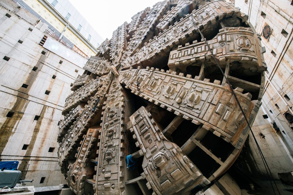 Close-up of a massive tunnel boring machine head at a deep shaft construction site, a massive tunnel boring machine, drilling, USA.