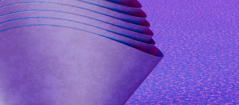 Rolled layers of purple paper with curled edges on a similarly colored textured surface.