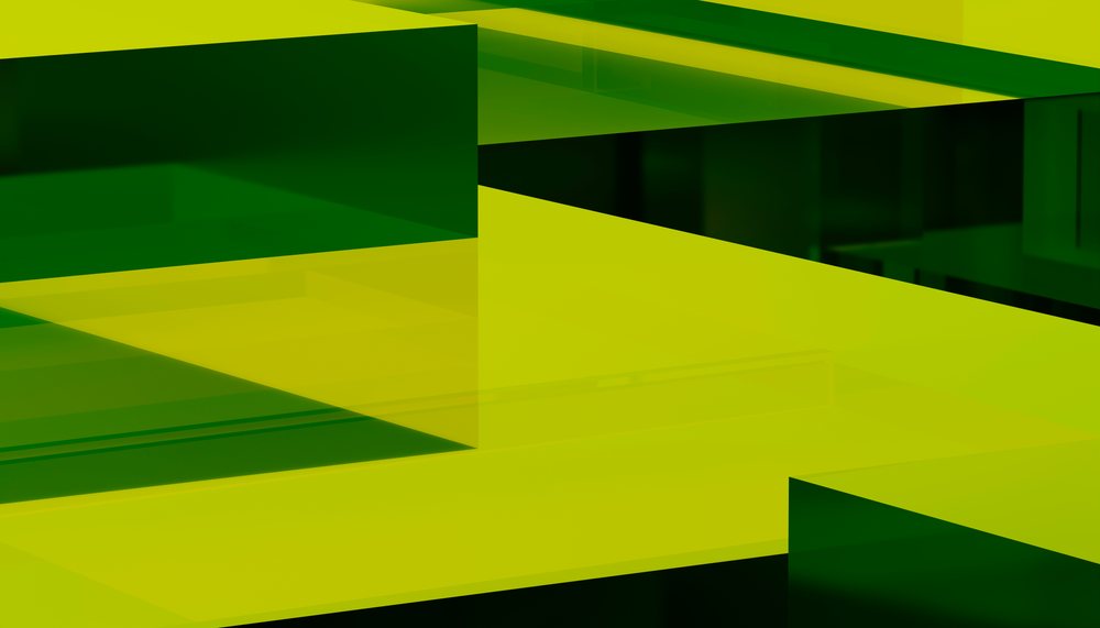 The image shows overlapping green and yellow translucent geometric shapes forming an abstract layered composition.