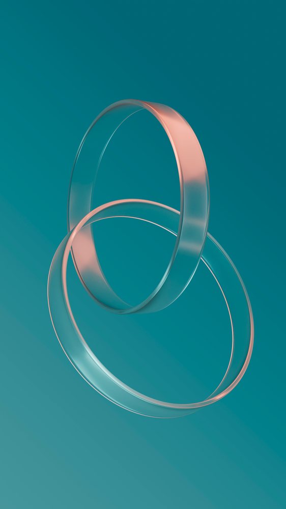 Two transparent rings intersect and float against a smooth blue background in a modern 3D illustration.