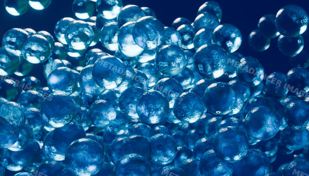 Macro close-up of floating blue translucent gel spheres