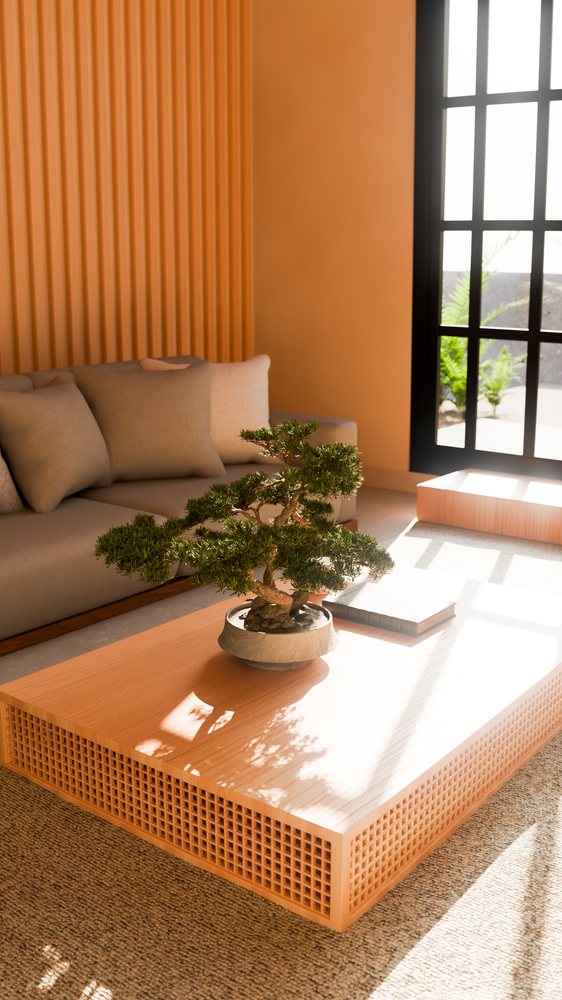 Bonsai tree in pot on wooden coffee table with perforated sides in a modern living room.