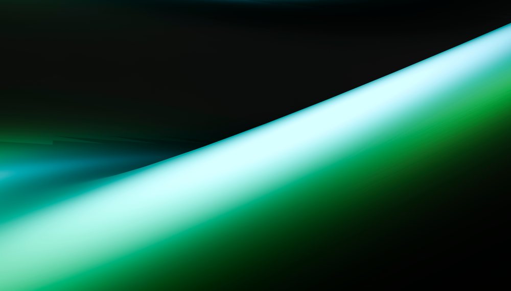 Light beam with green and blue gradients on a dark background creating an abstract luminous effect.