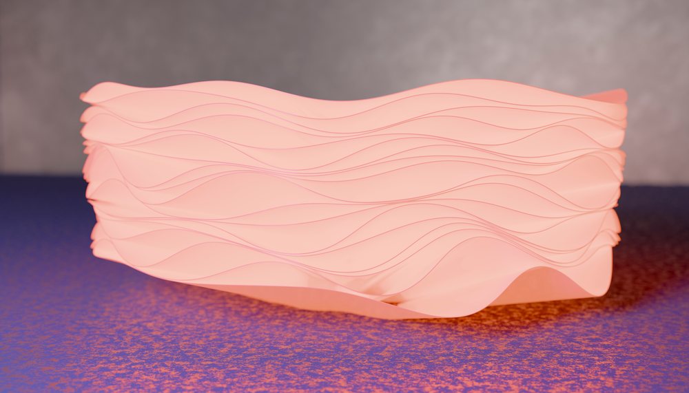 Decorative bowl with softly glowing wavy pattern resting on a textured surface indoors.