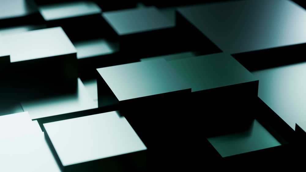 Stacked 3D cubes with reflective surfaces create an abstract geometric composition against a black background with blue tint lighting.