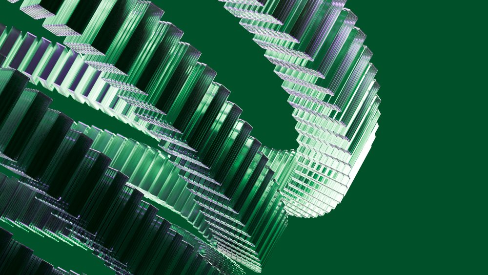 Twisted green glass shapes form a modern geometric pattern with reflective surfaces on a green background.