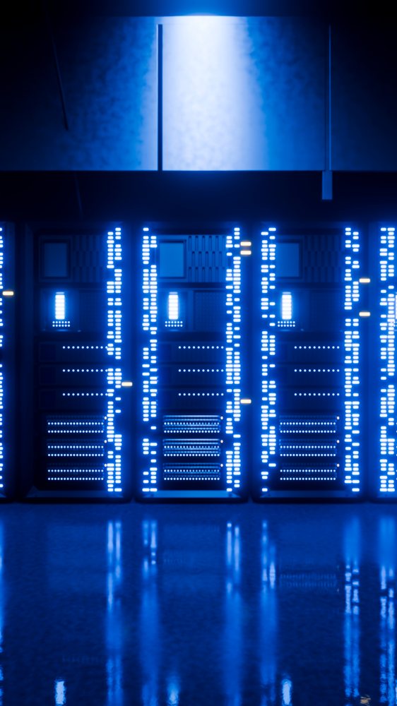 Multiple server racks with blue LED lights reflect on the floor inside a data center server room.