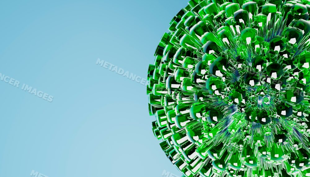 Close-up of a green geometric crystal glass sphere against a blue