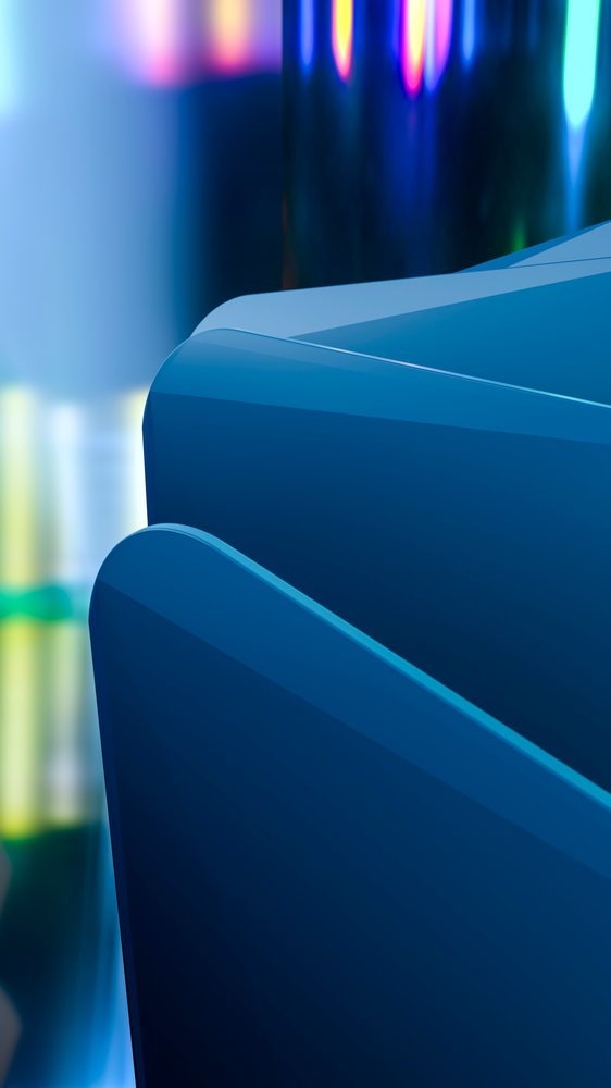 Abstract composition featuring smooth blue curved shapes with colorful light reflections and gradient effects.