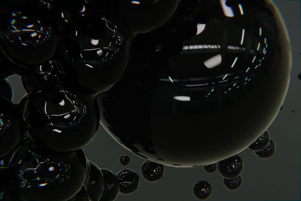 Cluster of glossy black spheres with smooth, shiny reflective surfaces on an abstract dark background.