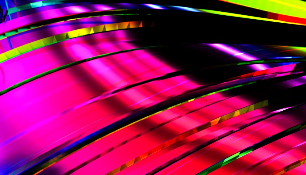 Colorful abstract digital design featuring vibrant stripes and glossy curved surfaces.