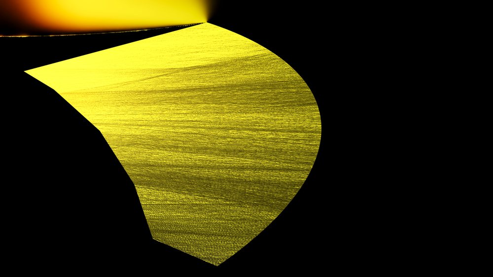 Abstract yellow light streaks form a curved textured pattern against a black background.