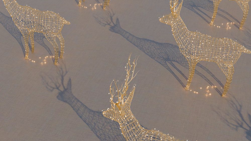 Decorative wireframe reindeer sculptures with holiday lights casting shadows on the ground in an outdoor holiday display.