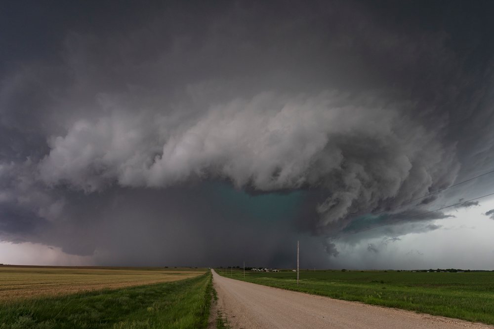 Supercell storm with dark clouds forms over rural fields, Storm Chasing, Weather, Environmental Issues, Enterprise, Kansas, USA.