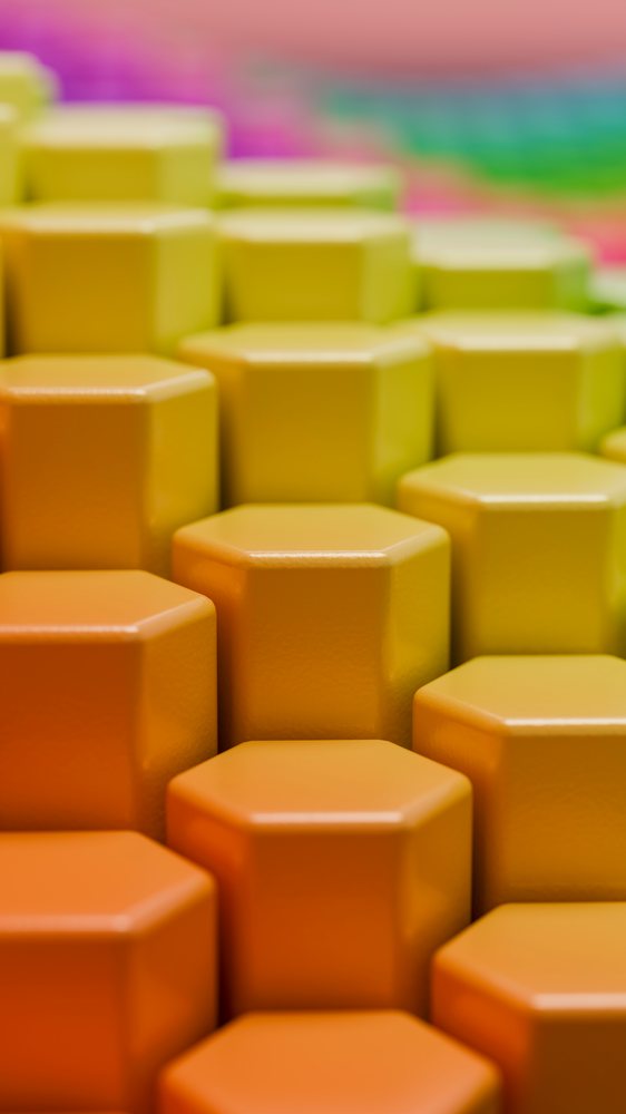 Abstract hexagonal columns create a smooth gradient from orange to yellow in a colorful 3D geometric pattern.