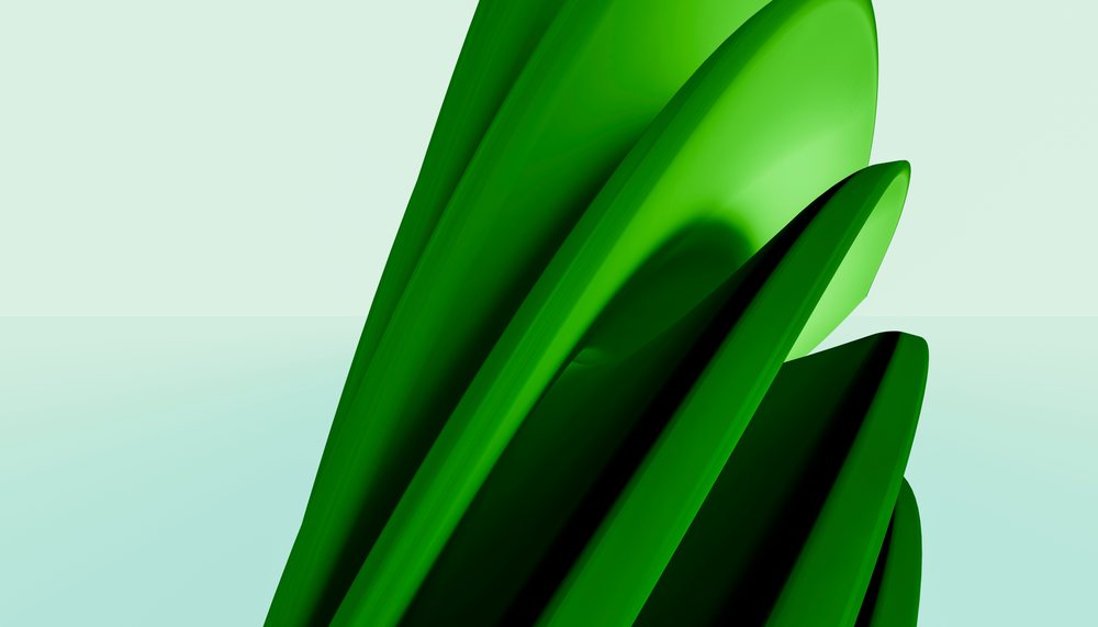 Green abstract sculpture featuring smooth, curved leaf-like shapes displayed in a minimalist studio environment by Garduna studio.