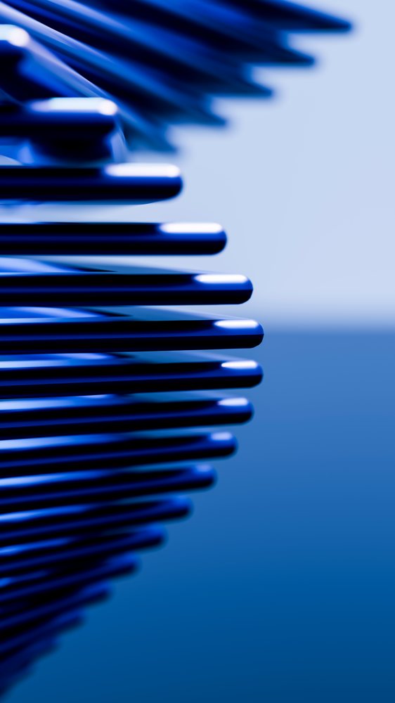 Close-up of blue metal rods stacked vertically forming an abstract geometric sculpture with reflective surfaces.