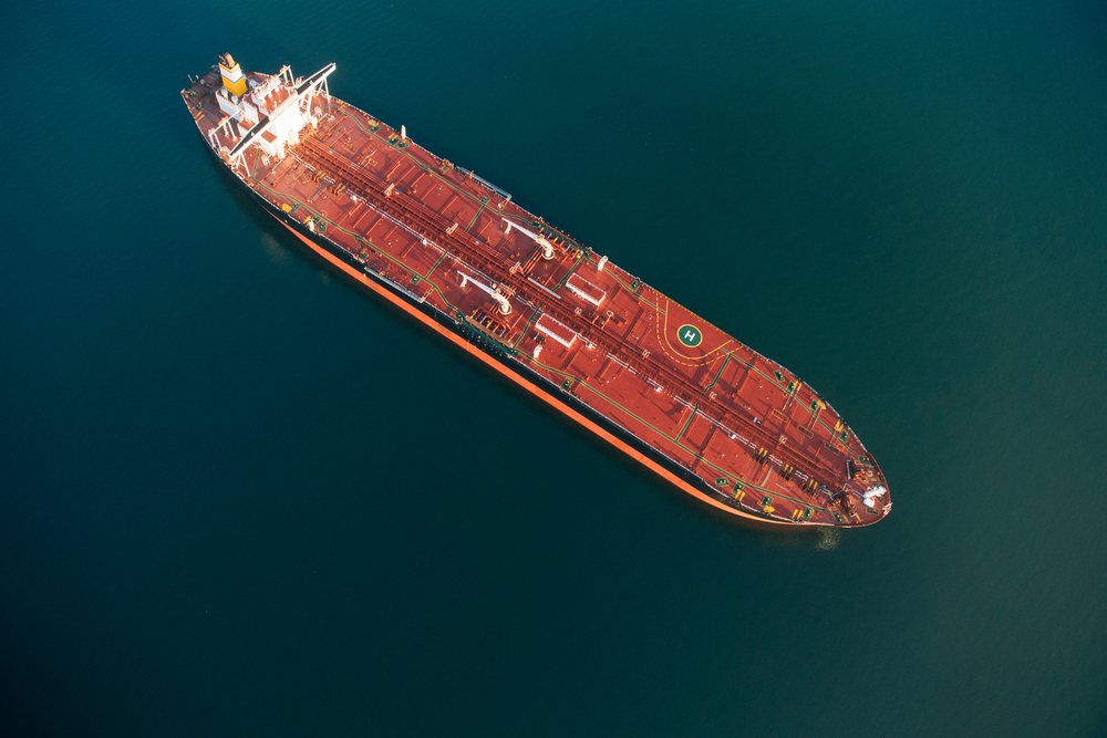 Oil tanker vessel floating in water at the Port of Long Beach, California, CA, USA.