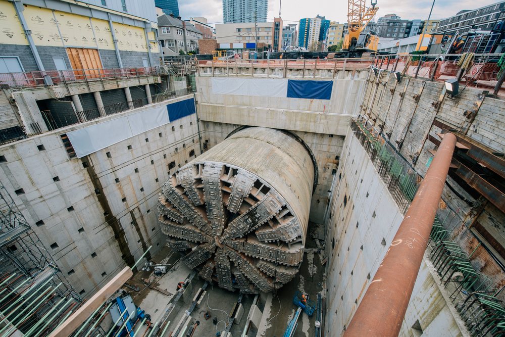 A tunnel boring machine is positioned inside a deep excavation site for tunnel construction, the tunnel boring machine, drilling, USA.