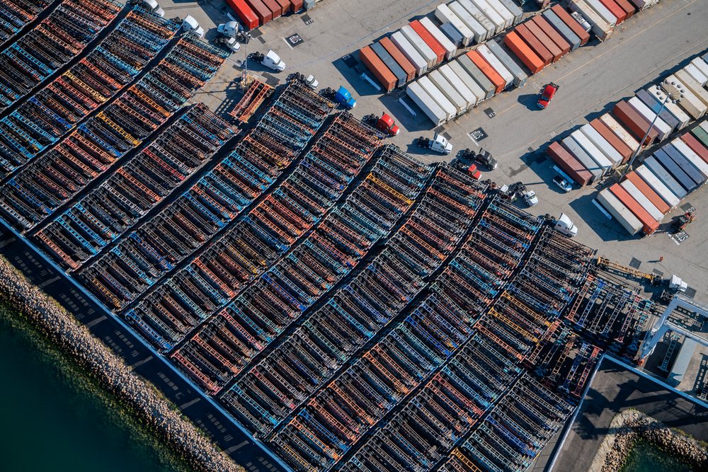 Container chassis and truck trailers parked in rows at a busy port in California, port, CA, USA.