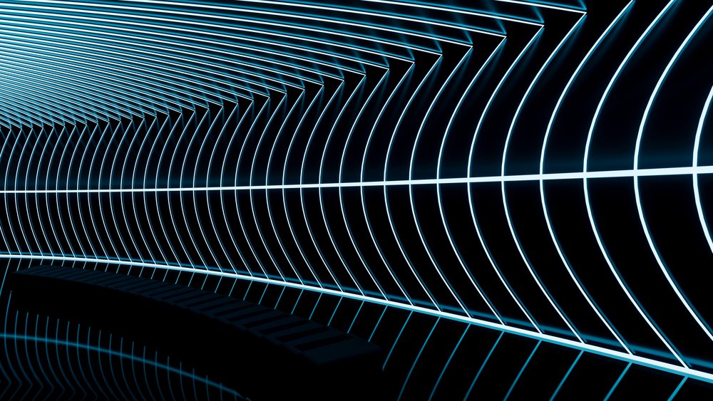 Curved tunnel interior illuminated by blue neon lines forming a geometric light pattern against a dark background with reflections on the floor.