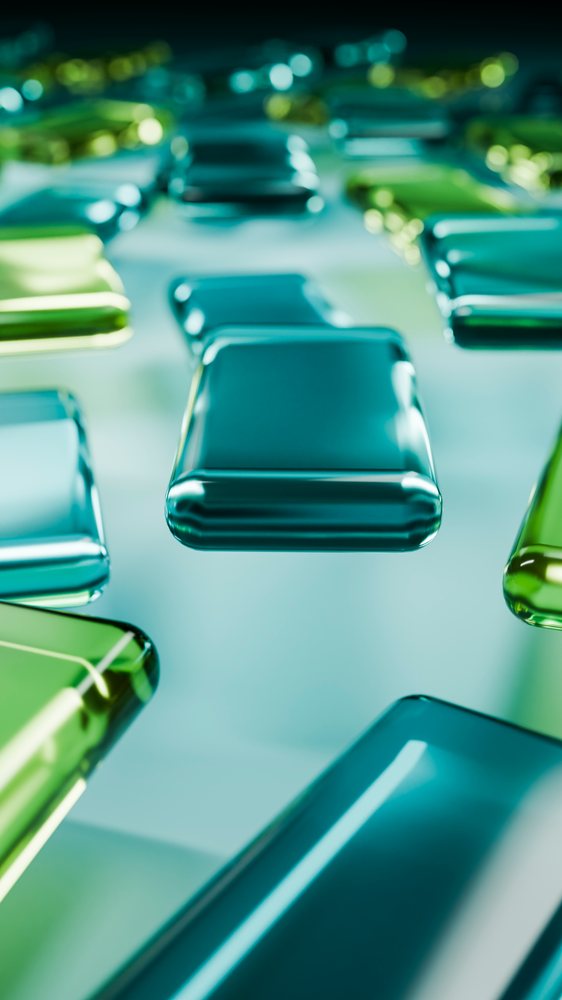 Glossy blue and green rectangular glass blocks arranged in an abstract geometric digital illustration.