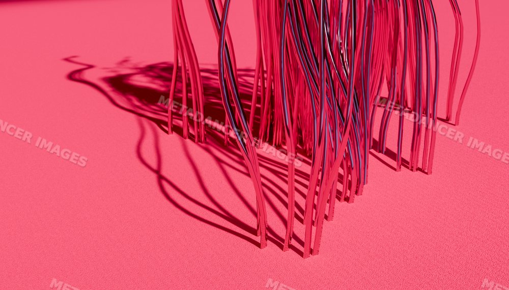 Abstract reflective metal sculpture casting shadows on a pink