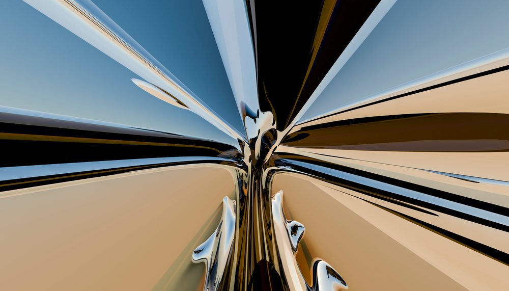 Close-up view of a shiny distorted reflective metallic surface