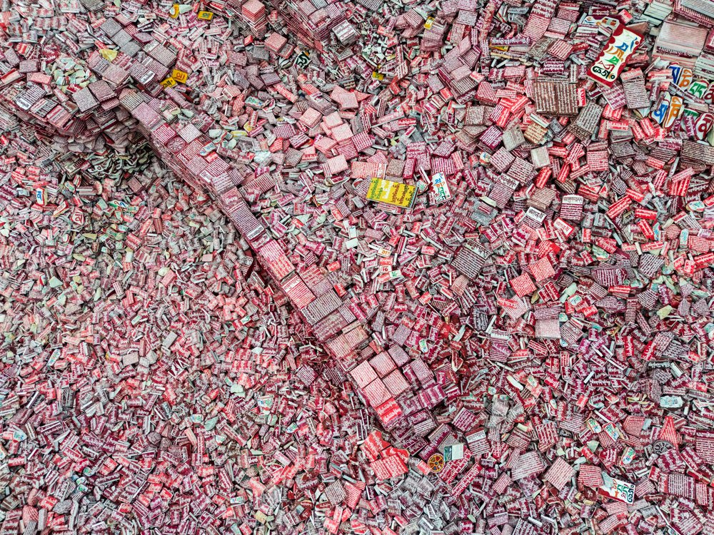 Aerial view of clustered prayer stones inscribed with multicolored mantras in an outdoor setting in Kham Tibet, China, Xinzhaia, Qinghai Province, People's Republic of China.