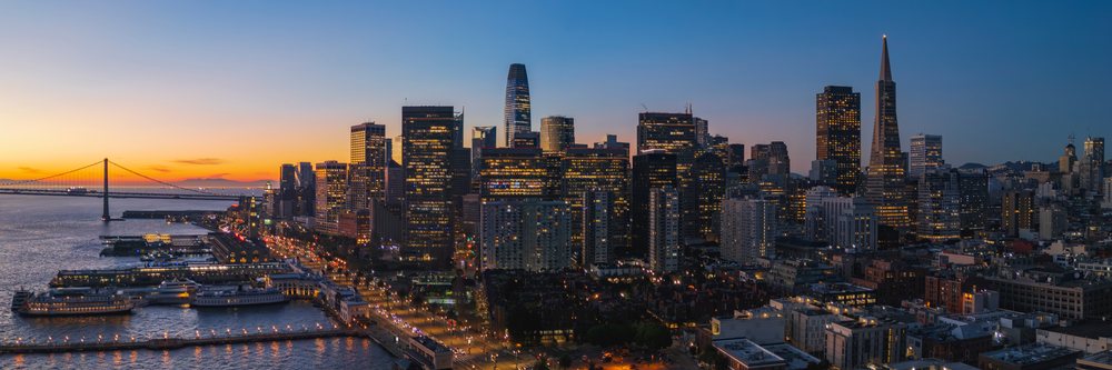 City skyline at dusk showing illuminated buildings and waterfront near Pier 7, landscape, cityscape, city life, San Francisco, California, USA.