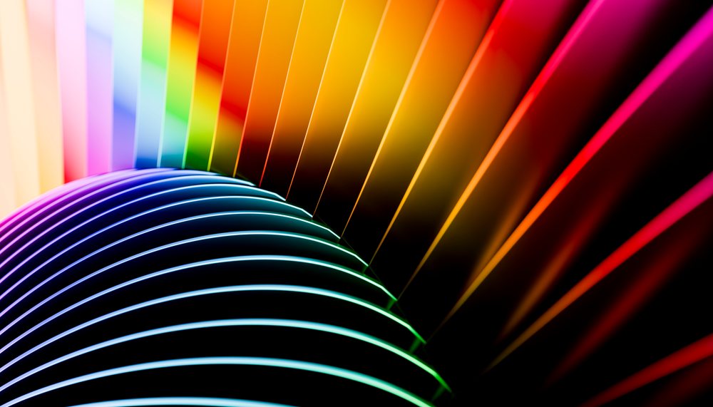 Abstract colorful curved lines with vibrant gradient and glowing light effect.