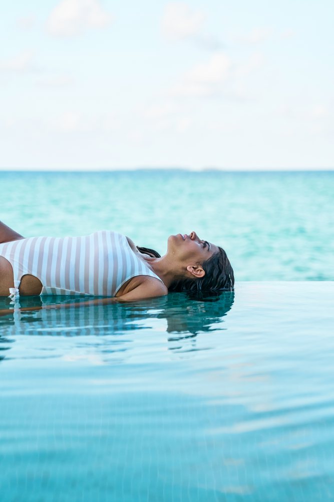 A white woman floats peacefully