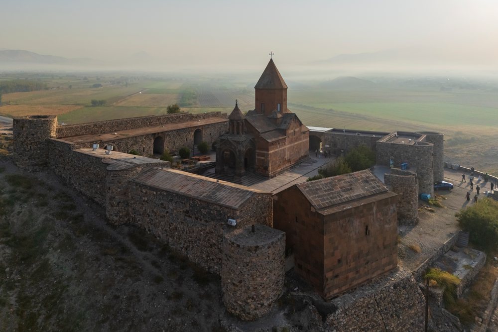 Khor Virap Monastery on a hill with Mount Ararat and the Ararat plain, visible behind it, Lusarat, Ararat Provincea, Armenia.
